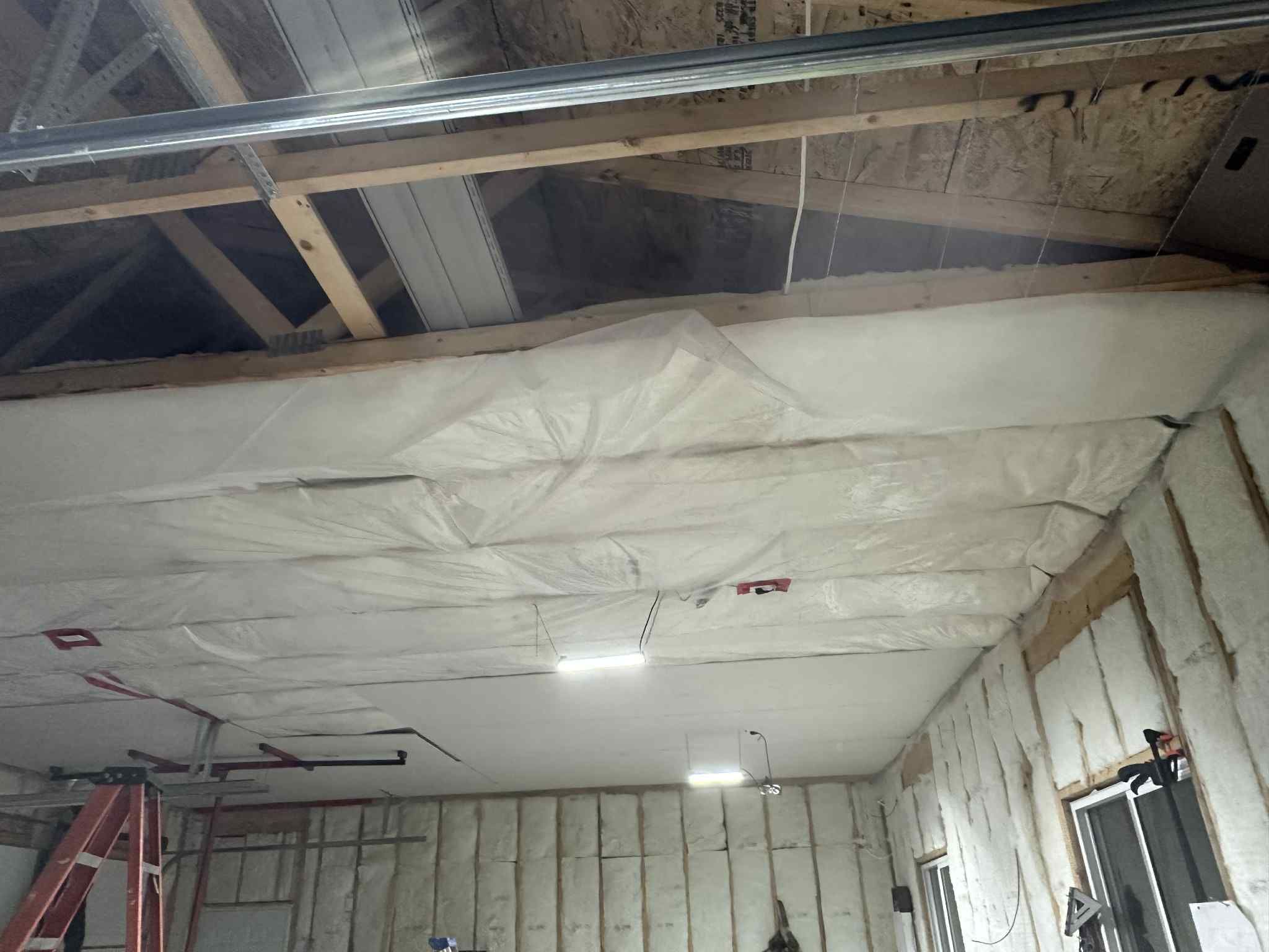 Drywall garage installation with wainscoting and floating mantel